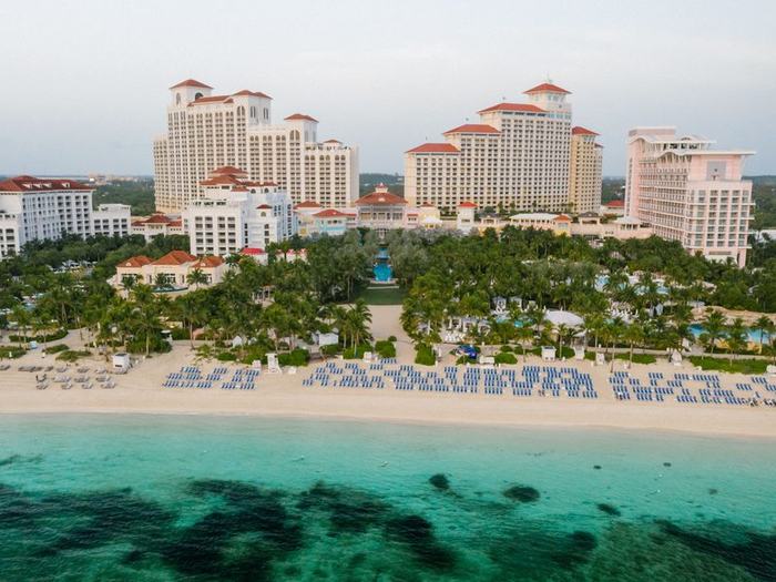 Baha Mar resort towers rising behind Cable Beach at dusk